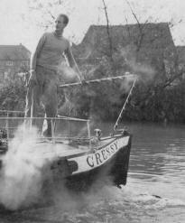 Tom Rolt steers the narrow boat 'Cressy'